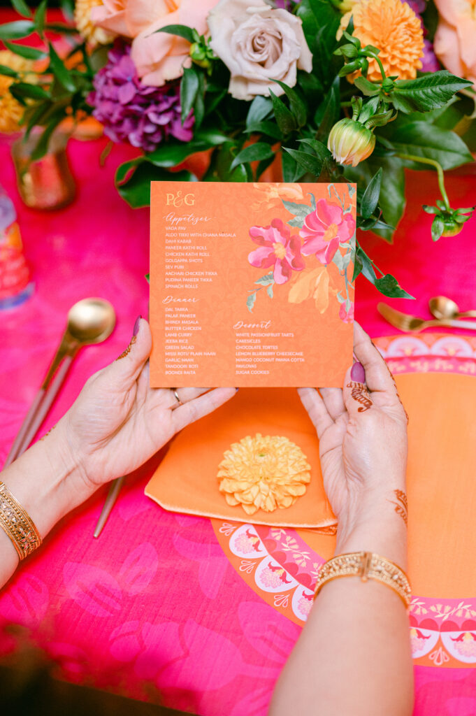 Colorful wedding stationery details styled for South Asian wedding traditions