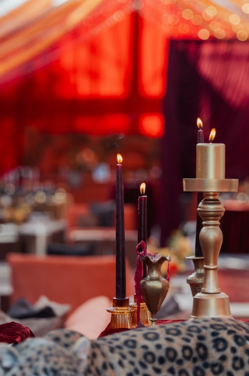 Ceremonial candles and decor set around the sacred fire, creating a focused atmosphere for the Phere ritual in South Asian Wedding Traditions.