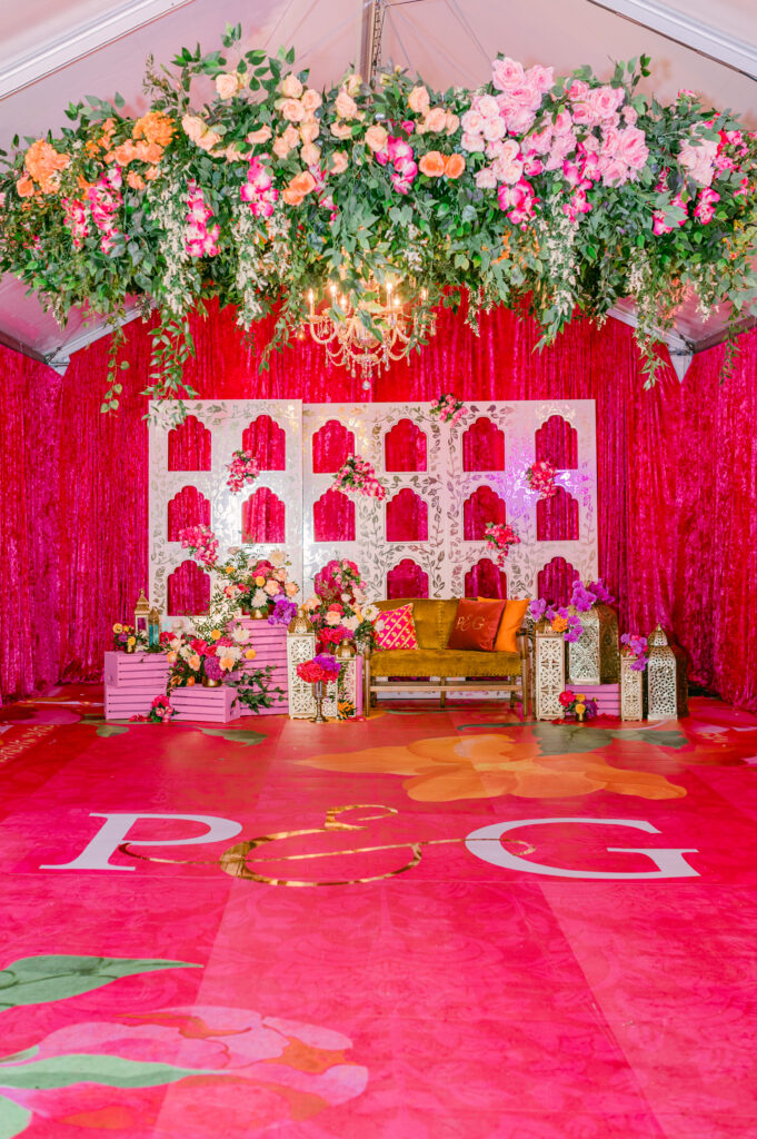 Floral stage design for Sangeet or reception in South Asian wedding traditions