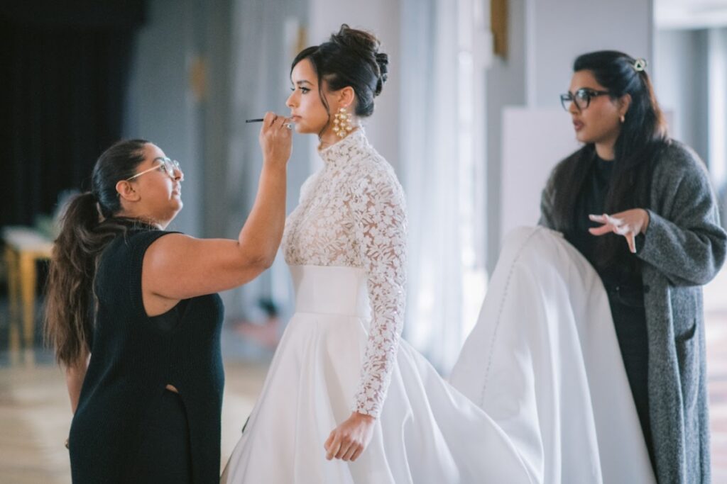 Luxury wedding meaning shown through behind-the-scenes coordination, with a wedding planner and team ensuring every detail is handled seamlessly