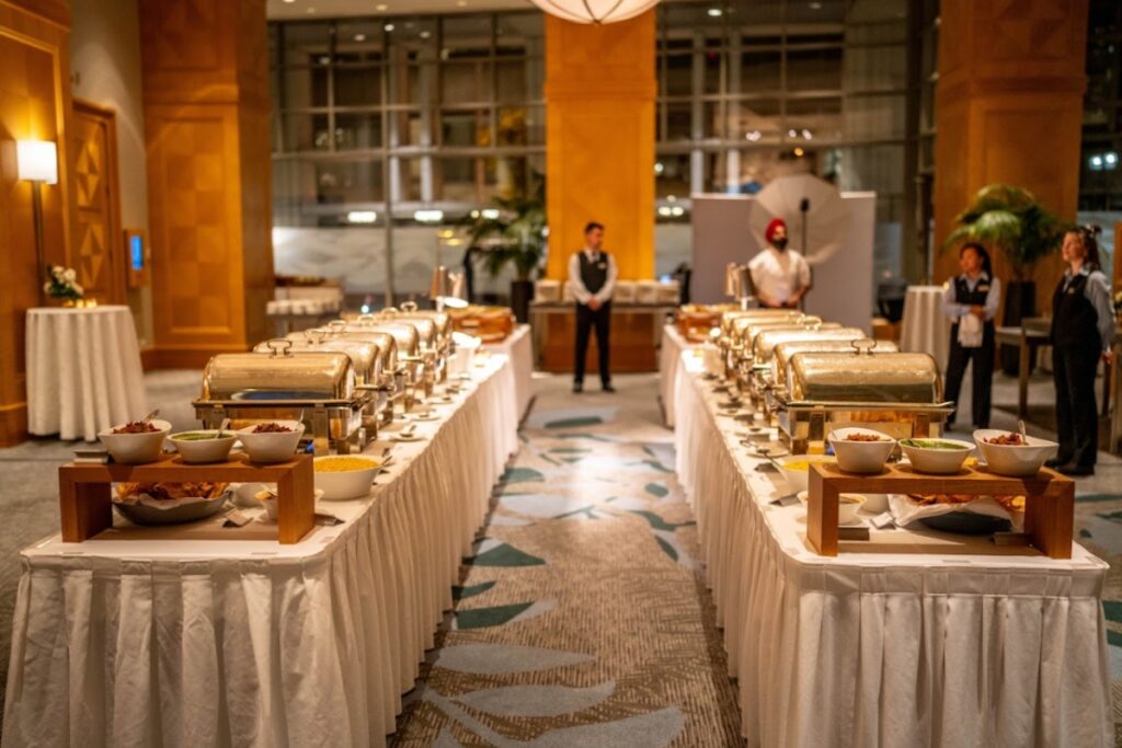 Luxury wedding meaning demonstrated through seamless guest service, organized catering setup, and thoughtful event flow
