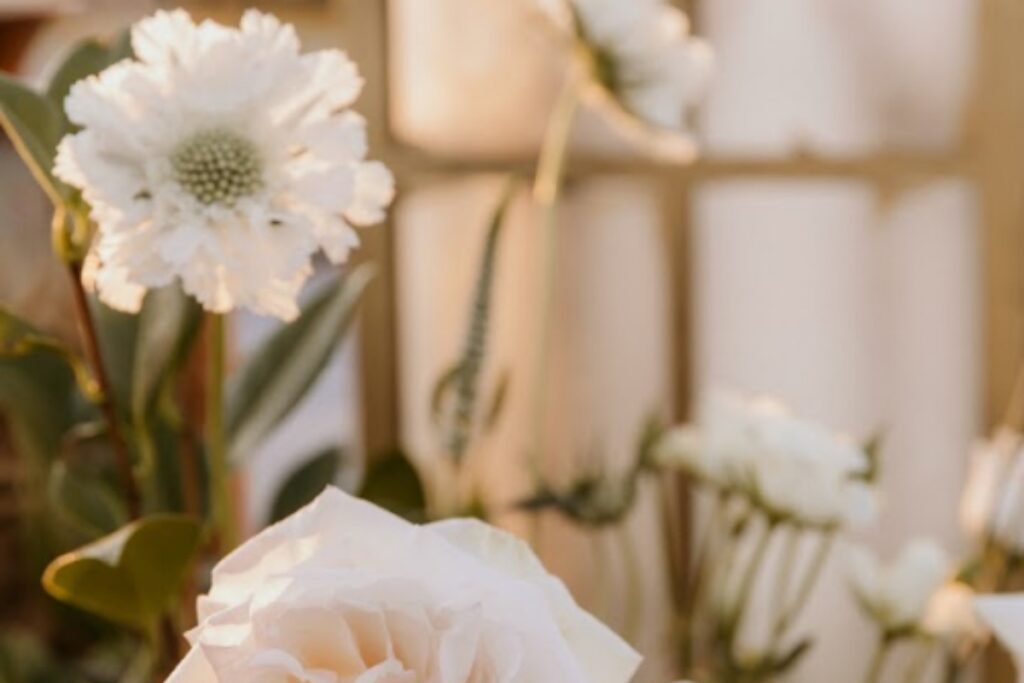 Soft floral and candle details styled for an intimate setting in South Asian wedding planning design